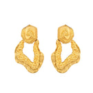 Gold Hera earrings by Jude Benhalim featuring elegant, shiny gold hoops with intricate detailing, displayed on a neutral background.