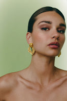 Gold Hera earrings by Jude Benhalim featuring elegant hoop design with intricate detailing.