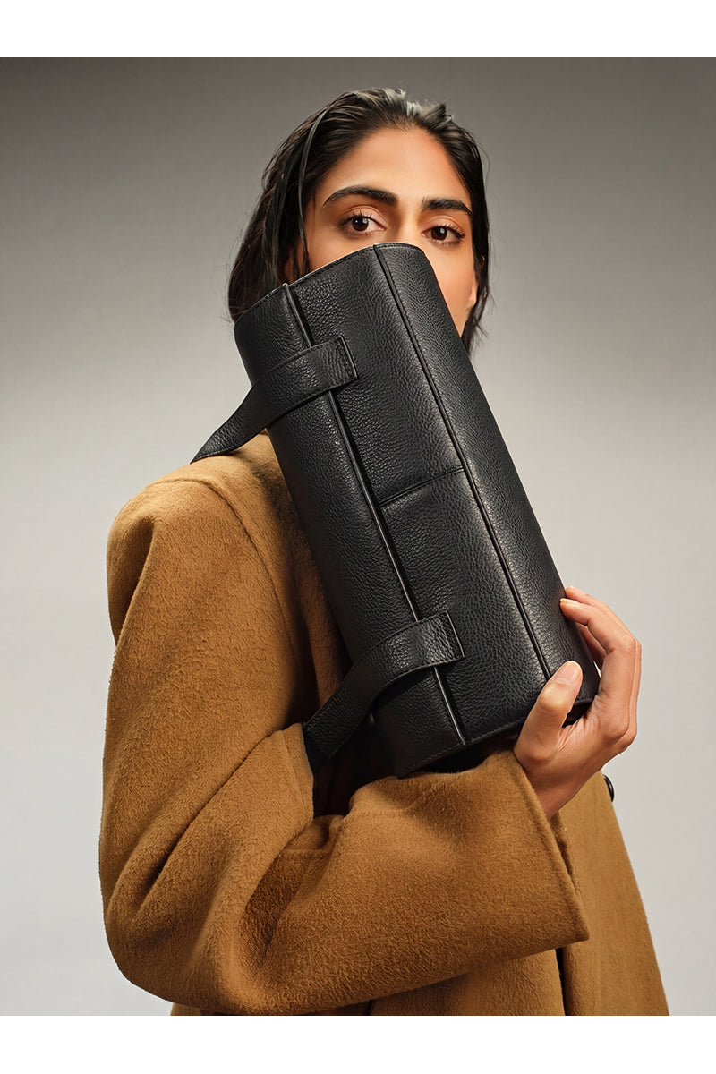 Black pebble leather Michelle shoulder bag by behno New York, featuring a sleek design and shoulder strap.