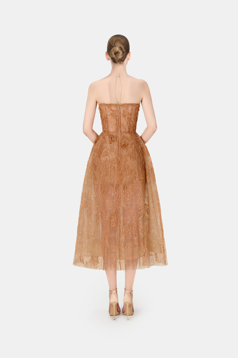Elegant honey beaded lace gown by Montsand featuring intricate beadwork and a flowing silhouette.