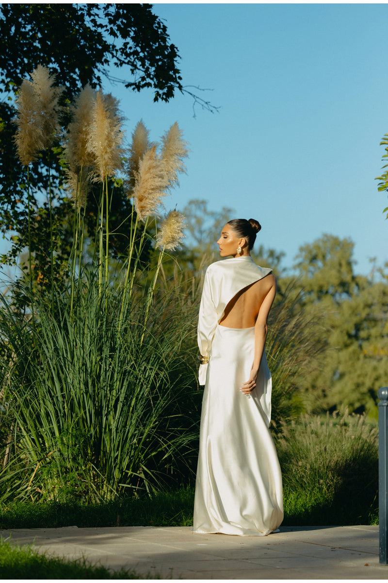 Elegant MATTERS Cannes Pearl Dress gown with intricate pearl embellishments and flowing fabric, suitable for formal occasions.