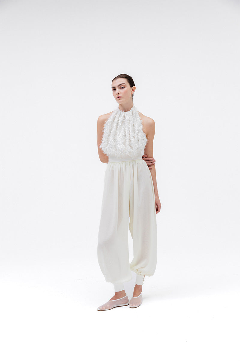 Studio NK Idil Ivory top, stylish sleeveless blouse with a relaxed fit, perfect for casual or office wear.