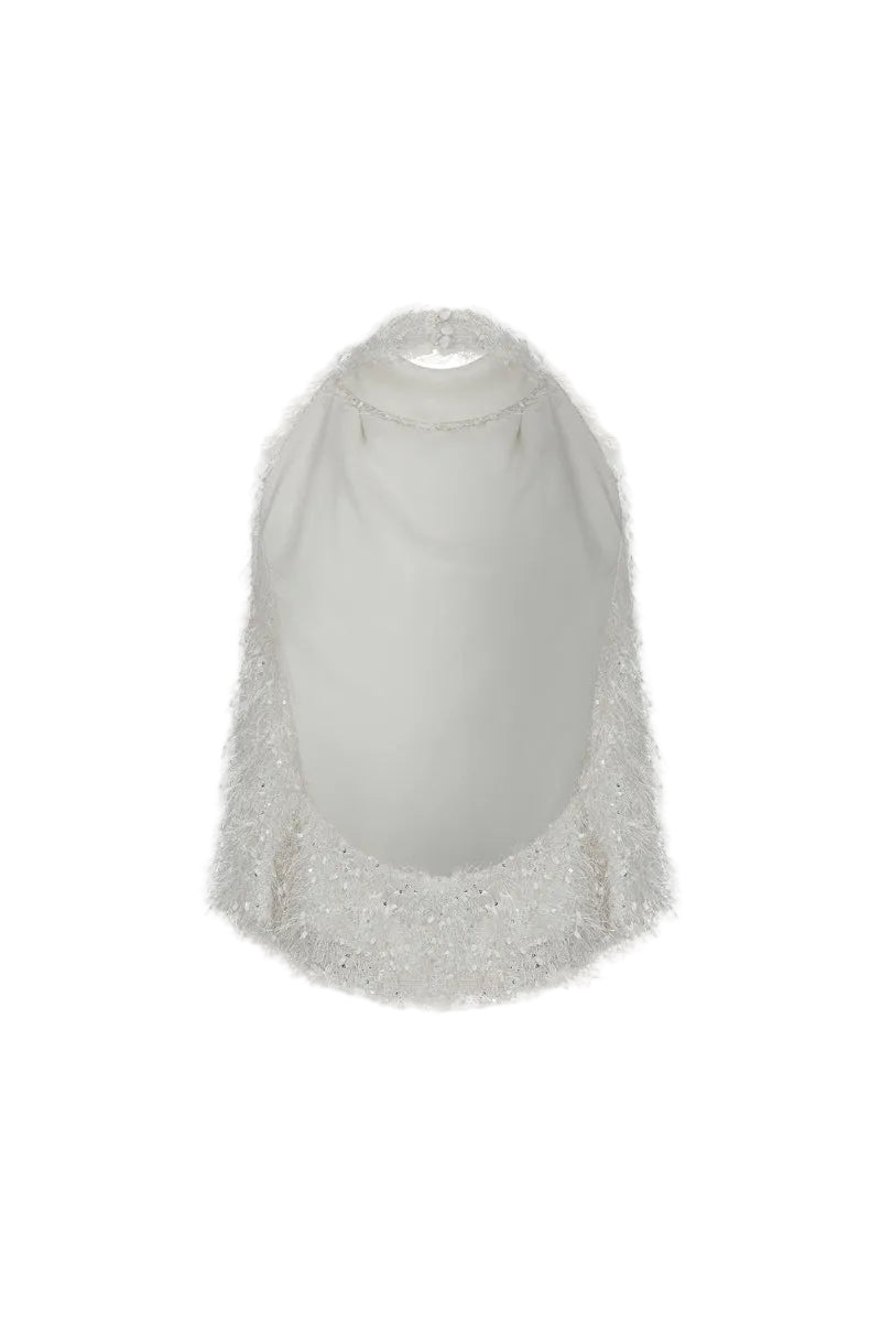 Studio NK Idil Top in ivory, stylish sleeveless blouse with a relaxed fit, displayed on a model.