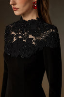 Black crystal-embellished lace column gown by I.H.F featuring intricate lace details and a sleek, elegant silhouette.