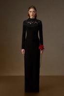 Black crystal-embellished lace column gown by I.H.F, featuring elegant design and intricate lace details.