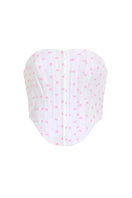 Pink polka dot Candy Top by IKINITA featuring a stylish sleeveless design and playful pattern on a white background.