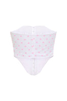 Pink polka dot candy top by IKINITA, featuring a playful design and white background, perfect for casual or stylish outfits.