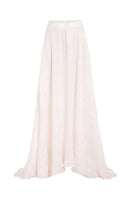 White maxi skirt from IKINITA's Innocent Skirt collection, flowing fabric and elegant design perfect for casual or dressy wear.