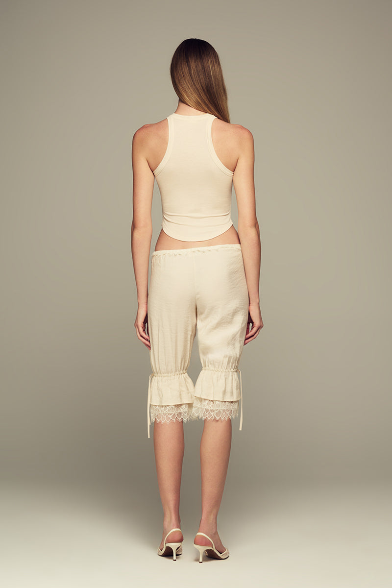 IKINITA Wave Top in Sand, stylish sleeveless blouse with wave design, lightweight fabric, perfect for casual or summer wear.