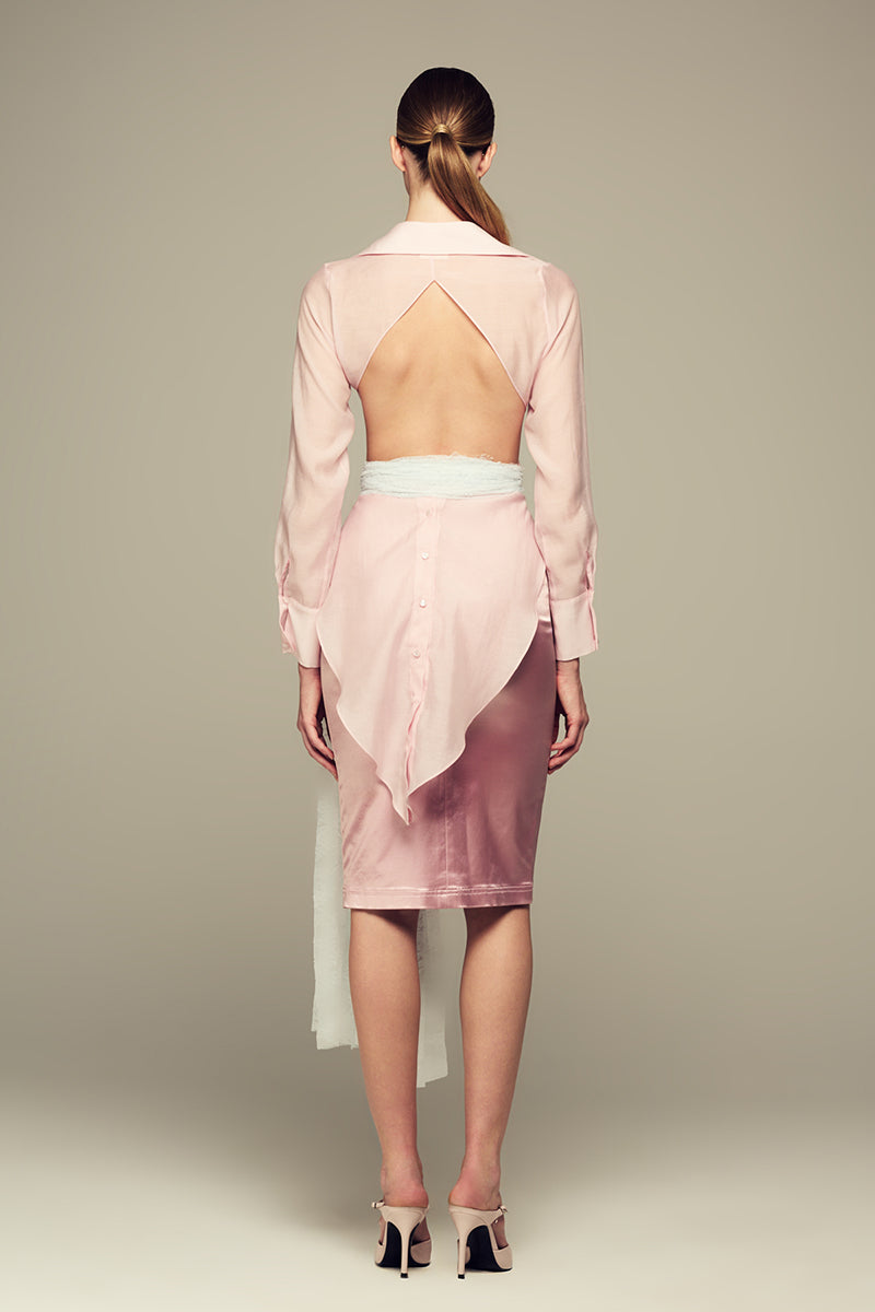 Pink Ulysse shirt by IKINITA, featuring a soft fabric and stylish design, displayed flat with buttons and collar.