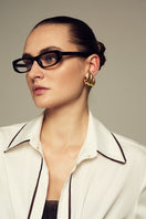 White boyfriend shirt by IKINITA, featuring a relaxed fit and classic collar, displayed on a hanger.