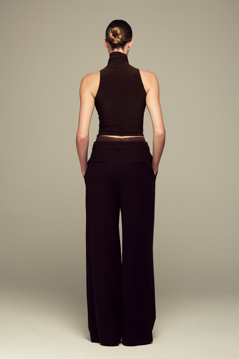 IKINITA brown moon pants featuring a relaxed fit and stylish design, displayed on a mannequin.