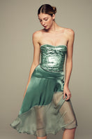 Emerald green Nausica midi skirt by IKINITA featuring a flowing, stylish design perfect for elegant everyday wear.