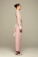 Pink IKINITA ULYSSE pants with a relaxed fit, featuring a comfortable waistband and stylish design.