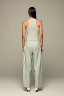 Blue IKINITA Wave Top, stylish sleeveless blouse with flowing fabric and wave design, perfect for casual and summer wear.