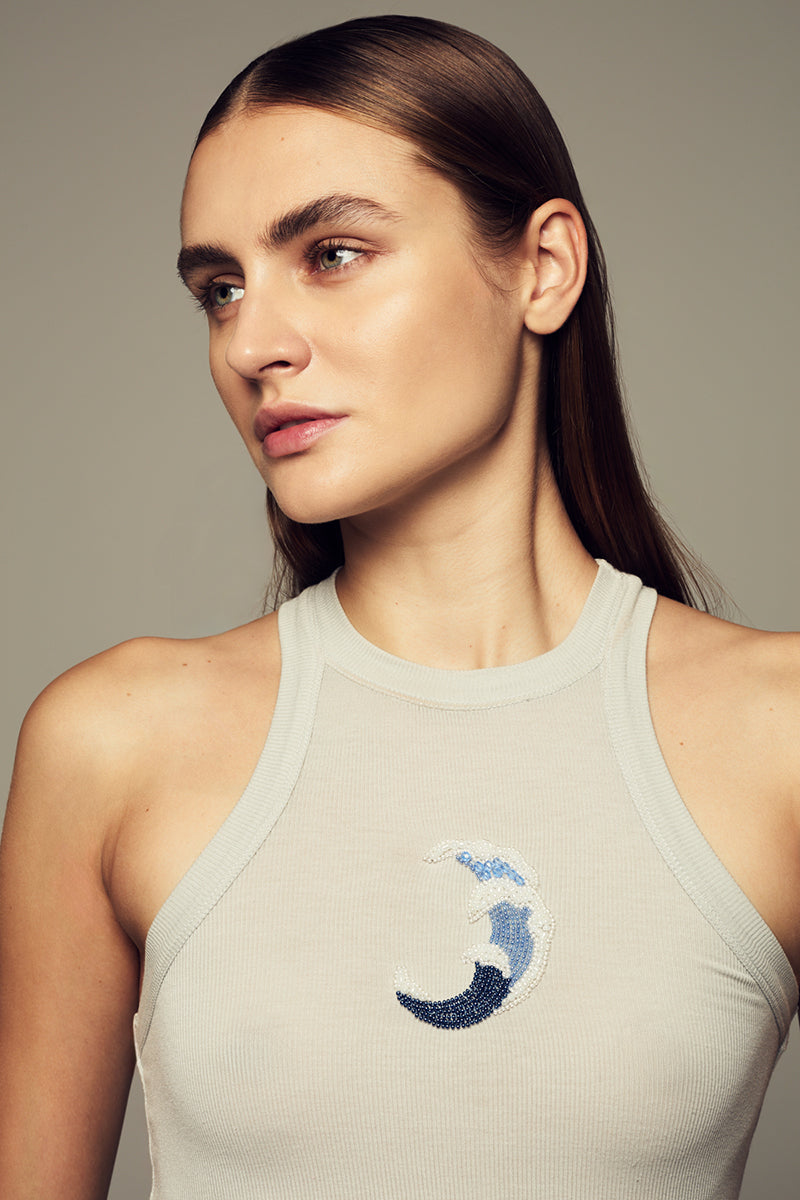 Blue WAVE TOP by IKINITA, stylish sleeveless blouse with wave pattern, perfect for casual or summer outfits.
