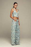 Blue IRIS top by IKINITA, featuring a stylish design and comfortable fit, shown on a model.