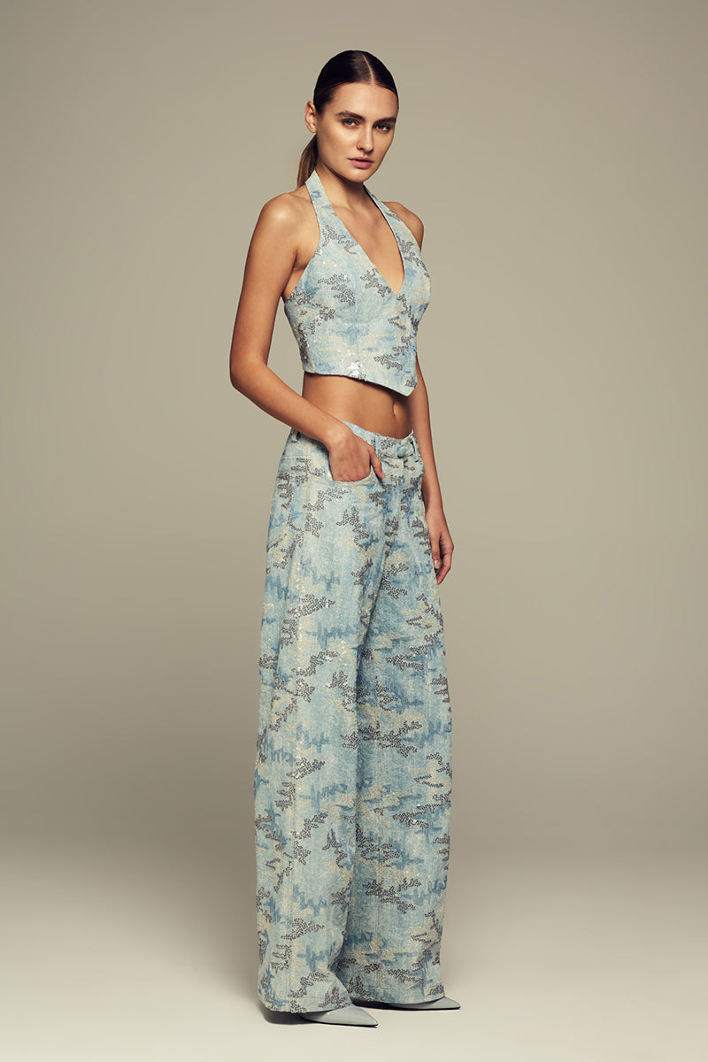 Blue IRIS top by IKINITA, featuring a stylish design and comfortable fit, shown on a model.