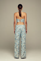 Blue IRIS top by IKINITA, featuring a stylish design and lightweight fabric, ideal for casual or dressy outfits.
