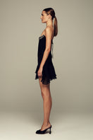 Black IKINITA Wave Corset top featuring a fitted design and stylish detailing, perfect for a trendy, modern look.