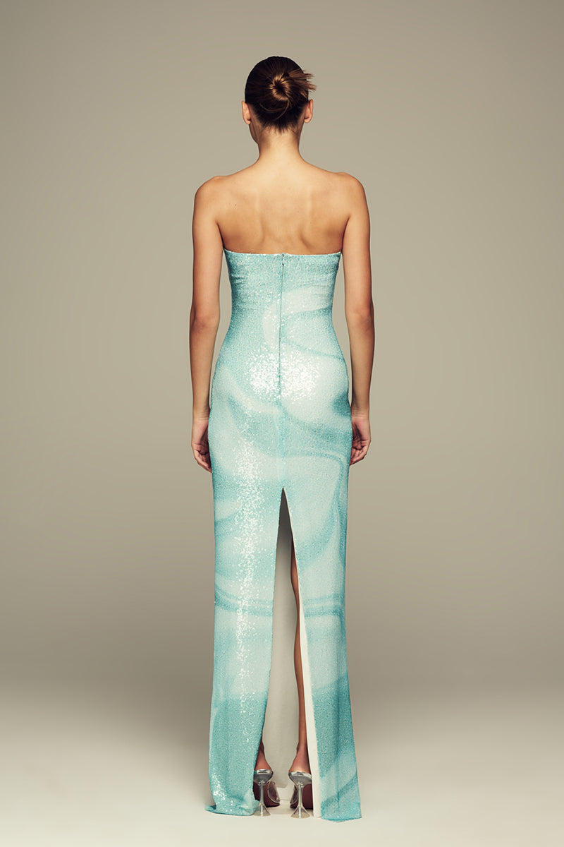 Blue water gown by IKINITA featuring flowing fabric and elegant design, perfect for formal occasions.
