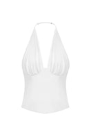 White corset top from Stolen Stores with pleated detailing, designed to enhance the waist and create a stylish silhouette.