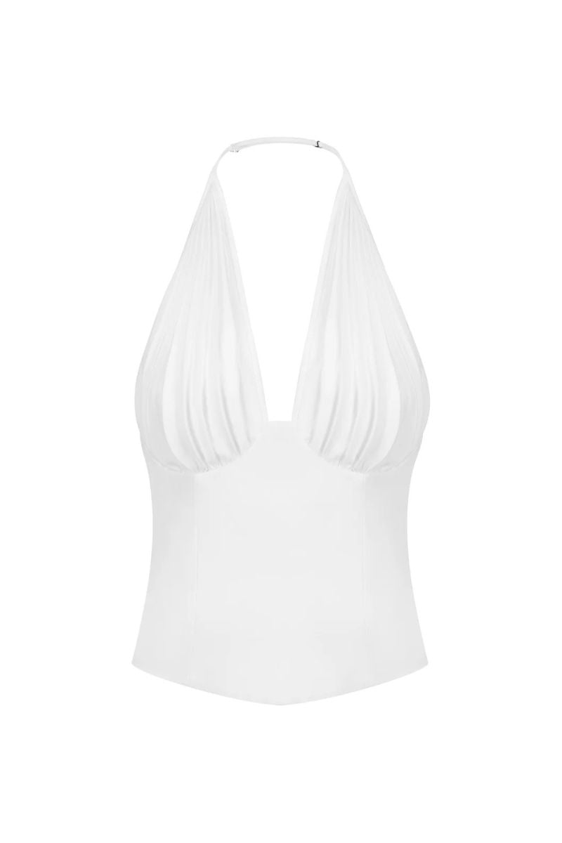 White corset top from Stolen Stores with pleated detailing, designed to enhance the waist and create a stylish silhouette.