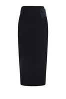 Black LEKIEU PAMPLONA midi skirt displayed on a hanger, showcasing its sleek design and flowy fabric.