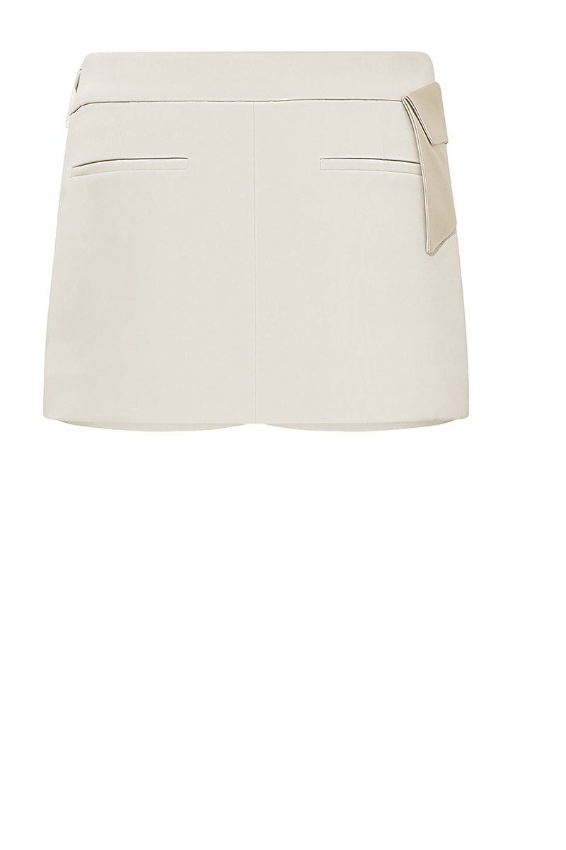 White Yorkshire mini skirt by Lekieu, featuring a stylish and fitted design, shown on a model.