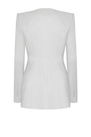 White Montpellier jacket by Lekieu, stylish outerwear with a tailored fit, shown hanging on a wooden hanger.