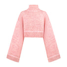Pink Sayya sweater with a cozy knit design, displayed on a hanger against a neutral background.