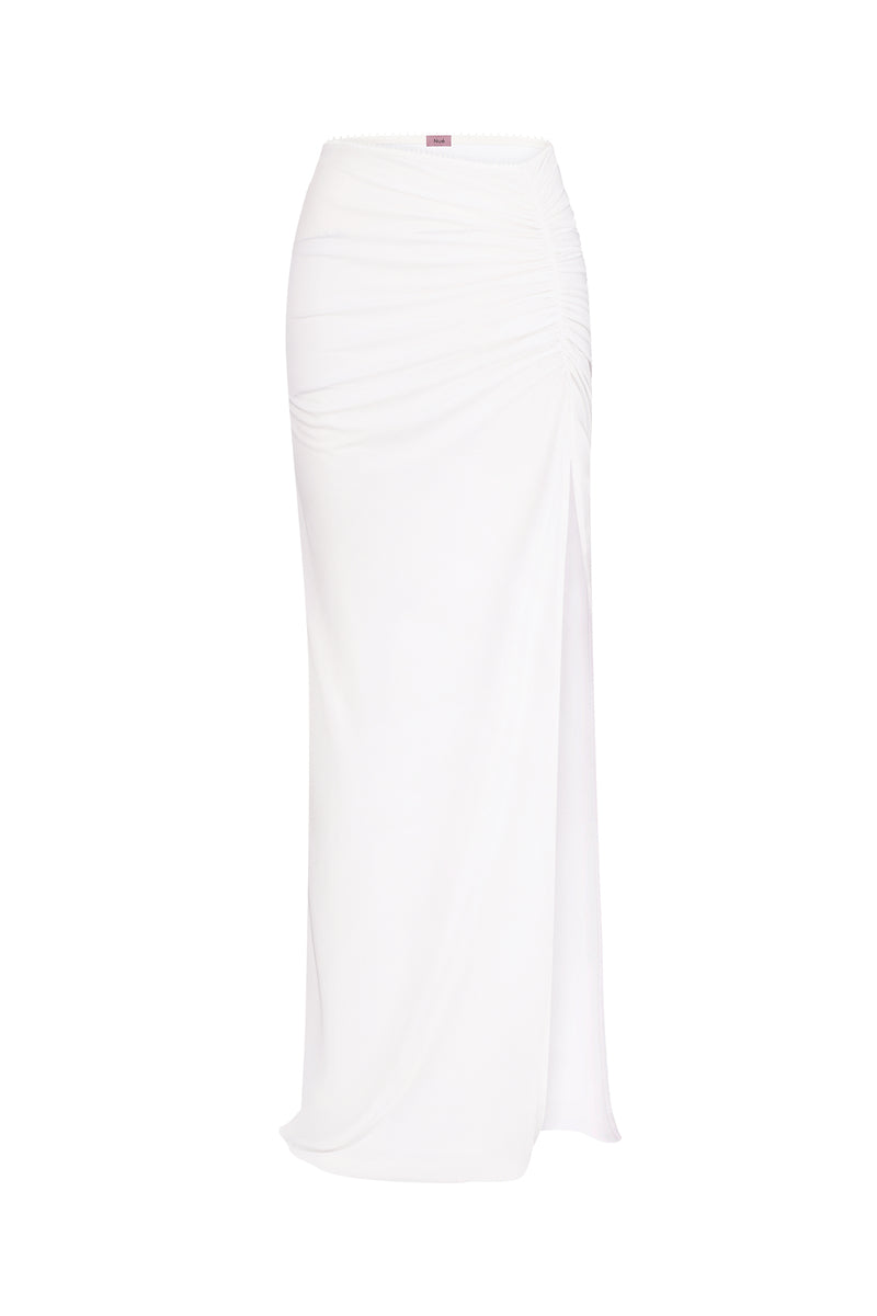Nué Blanche white maxi skirt shown in image, flowing fabric with a high waist and elegant design for casual or formal wear.