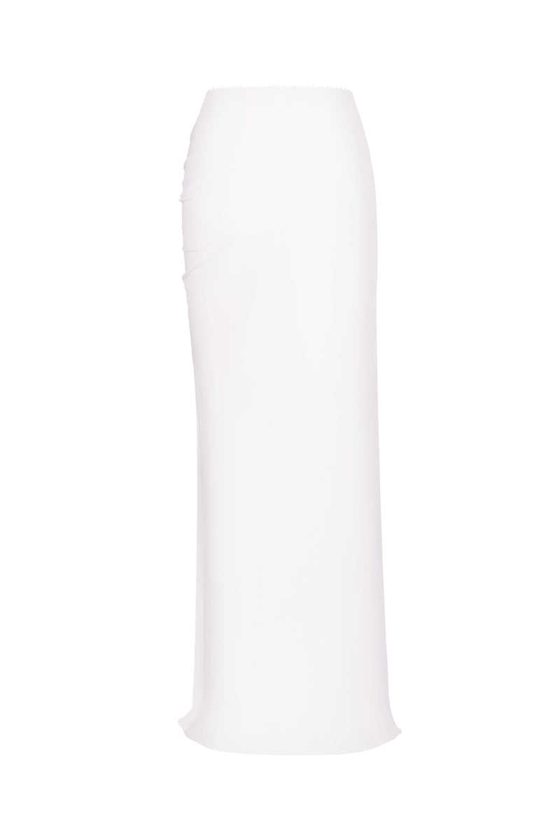 Nué Blanche white maxi skirt with flowing fabric and waistband, styled for casual or dressy wear.