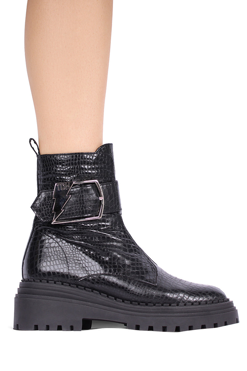 Black Festival Boots by Terry de Havilland featuring stylish ankle-length design and sleek leather material.