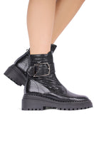 Black Festival boots by Terry de Havilland featuring ankle-high design and stylish stitching.