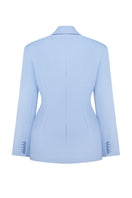 Nué DELPHINE blazer displayed on a hanger, featuring a tailored fit with classic lapels and stylish stitching details.