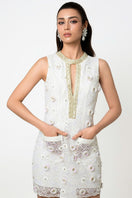 Valenciani mini lace dress with floral appliqué, featuring delicate lace fabric and intricate floral detailing.
