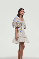 BY HAÓ Florienn mini dress in Jardin with floral print, fitted bodice, and short sleeves, styled for casual or summer wear.