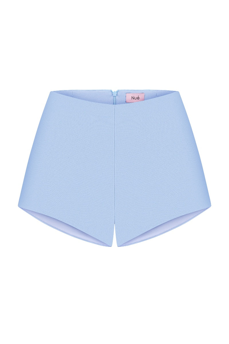Nué Delphine shorts in lightweight fabric, featuring a stylish design and comfortable fit, shown in a casual outdoor setting.