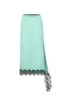 Sayya mint and black lace midi skirt displayed on a hanger, showing intricate lace details and flowy fabric.
