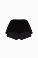 Black Balykina double shorts with a relaxed fit, shown on a model in a casual outdoor setting.