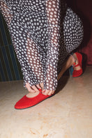 Flabelus Mellark red flats with matching red piping, featuring a sleek design and comfortable slip-on style.
