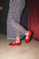 Flabelus Mellark red flats with matching red piping, stylish slip-on shoes for women, shown on a neutral background.