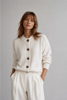 First Born Knits Frenchie Ete cardigan in soft knit, featuring a light, breathable design with a cute pattern.
