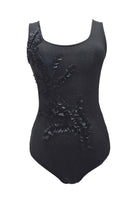 Arti Apparel ATUS bodysuit, stylish black top with long sleeves, fitted design, and crew neckline, on a neutral background.
