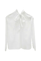 Arti Apparel CORA top, stylish women's sleeveless blouse in soft fabric, shown in a front view with vibrant color details.