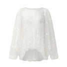 Arti Apparel Grace Top, stylish women's blouse with elegant design, displayed on a hanger.