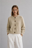 First Born Knits Frenchie Ete cardigan in soft fabric, shown with a button closure and ribbed cuffs on a neutral background.