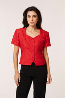 Señorita Aurora top in vibrant red, stylish sleeveless blouse with a fitted design, showcased on a neutral background.