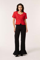 Red Señorita Aurora top, a stylish women's blouse with a flattering fit and vibrant color, shown in the image.